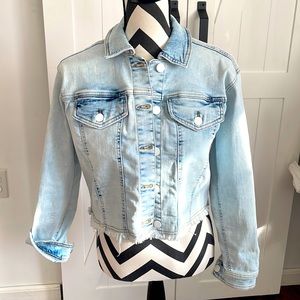 Light blue wash cropped Jean jacket. Distinctive frayed hem. Boho feel.